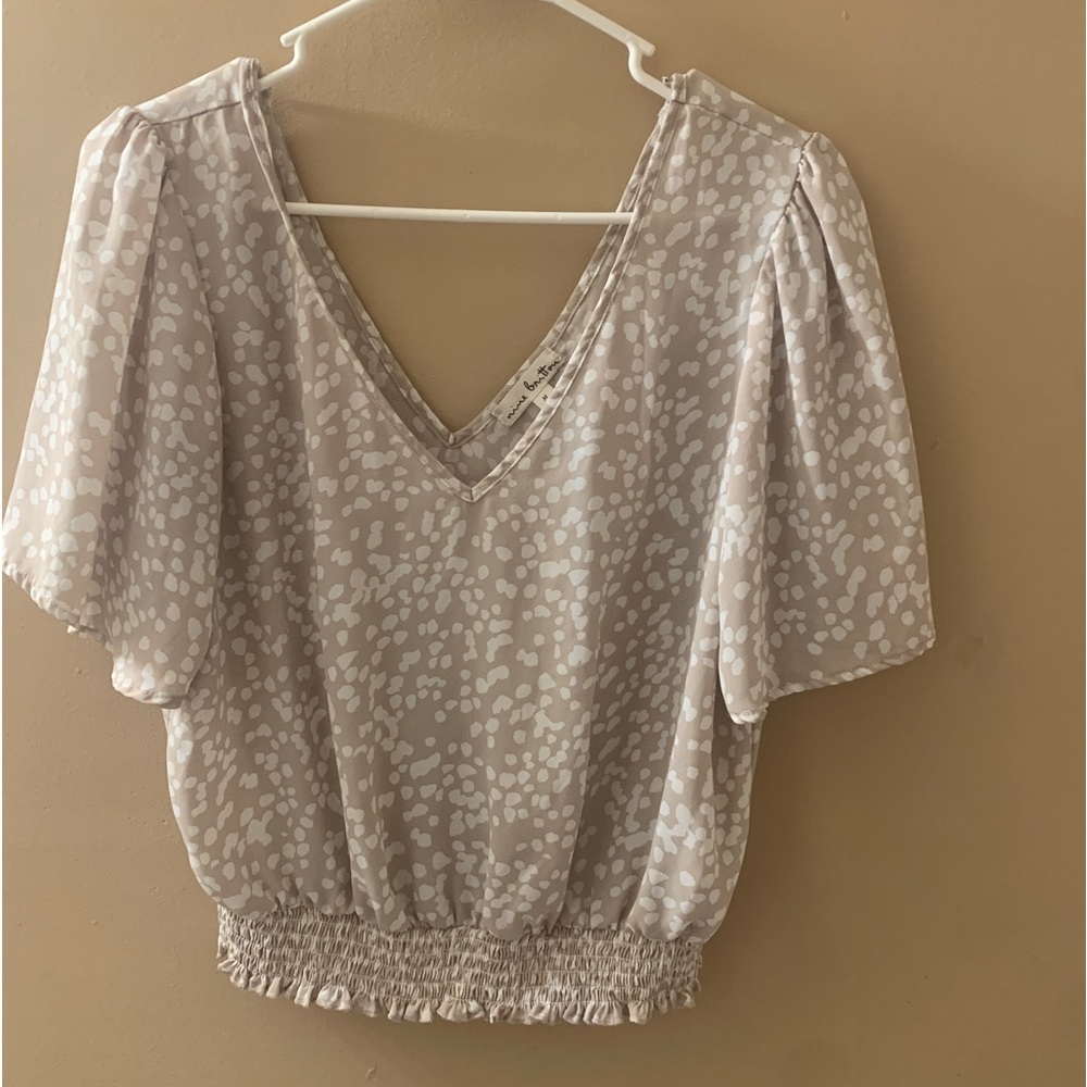cute beige and white spotted blouse!